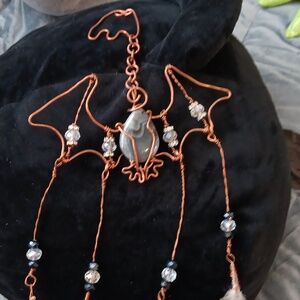 Bat agate wall hang with genuine farm feathers.